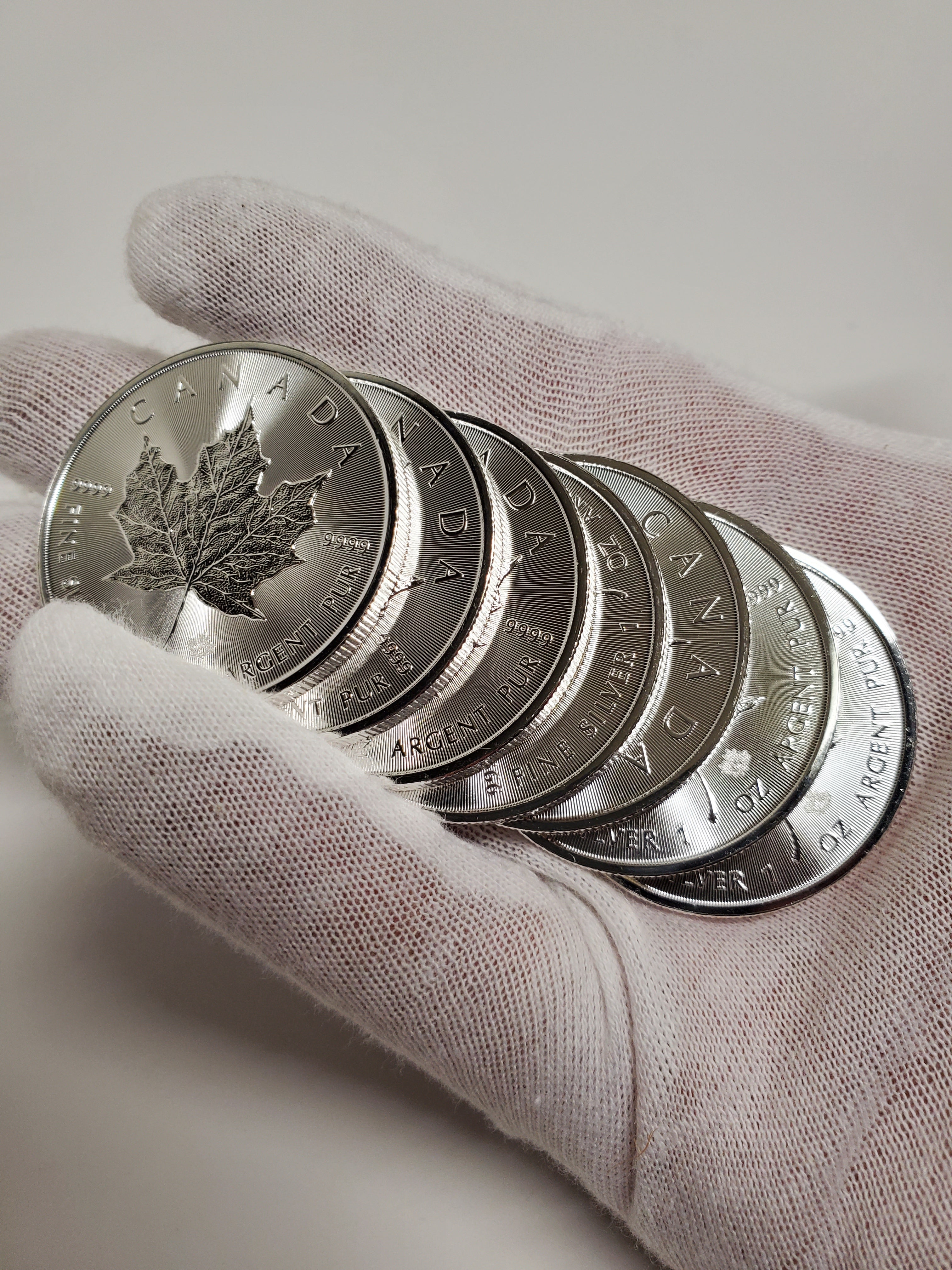 Holding Silver Coins Hand full of Silver Coins