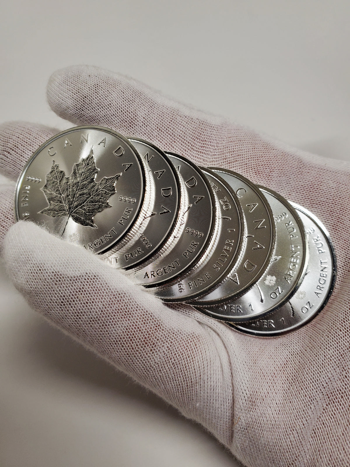 Hand full of Silver Coins