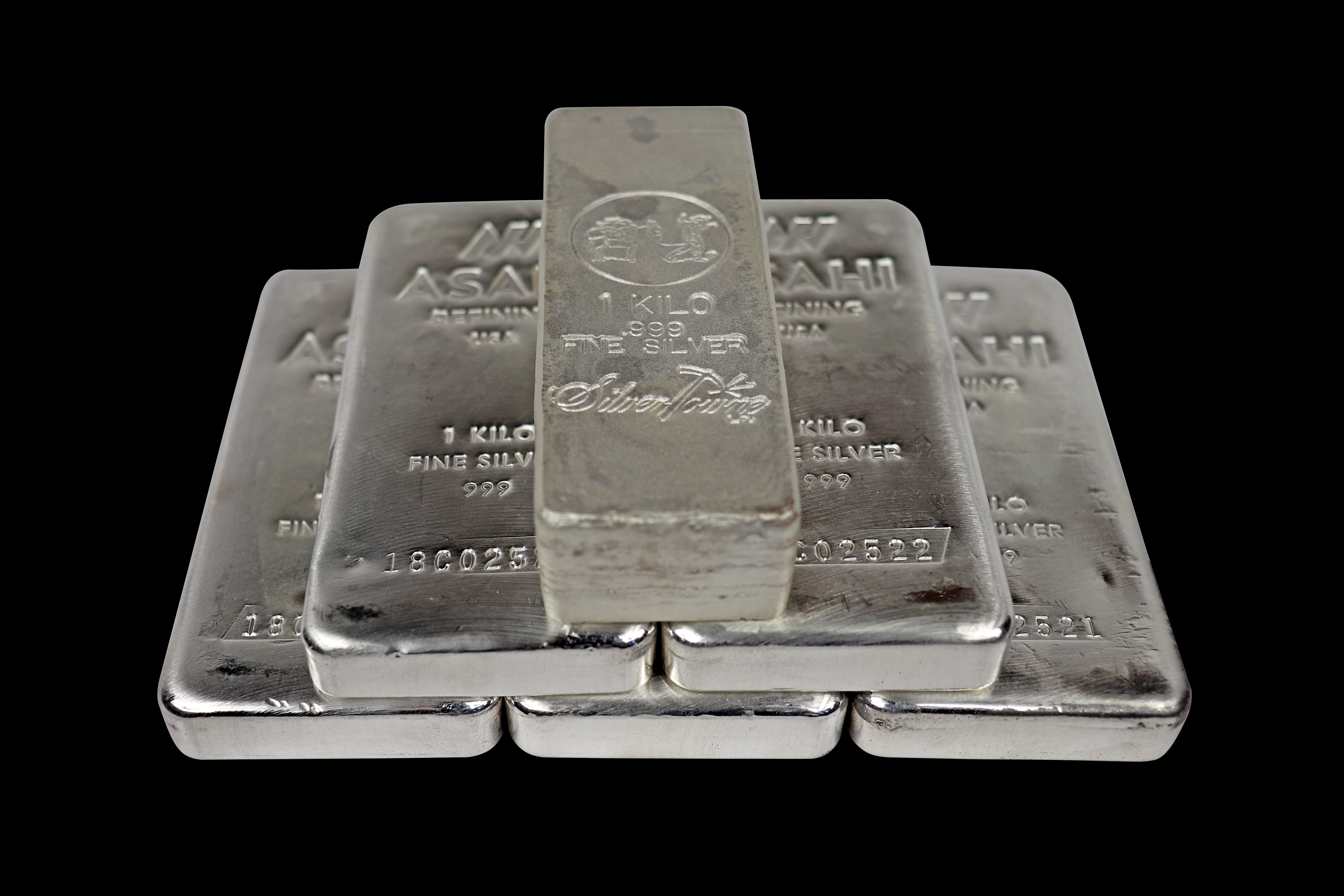 better to buy silver coins or bars