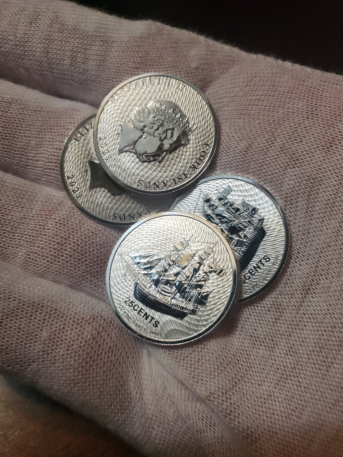 Silver coins in the hand