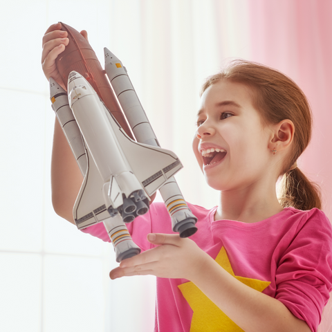 Girl with toy rocket