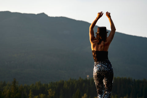 Girls at a hen party wearing black silver sequin flared trousers