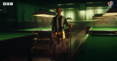 man in eurovision song contest official trailer for BBC wearing gold sparklebutt sequin shorts