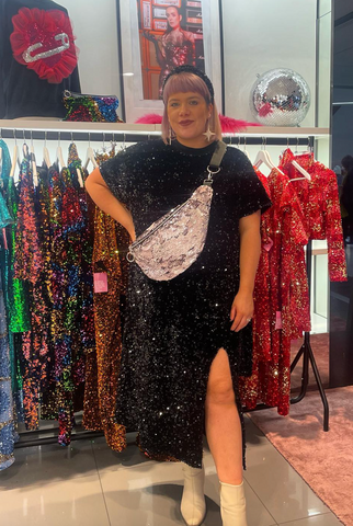 Sam from Isolated Heroes wearing the black sequin plus size dress available in sizes 12 - 28