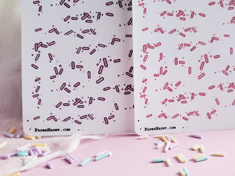 Pastel sprinkle and sparkle planner sticker sheets.