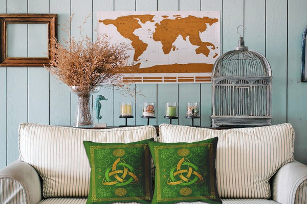 blue wood living room - dry plants - bird cage - world map wall art - decorative candles - green pillows