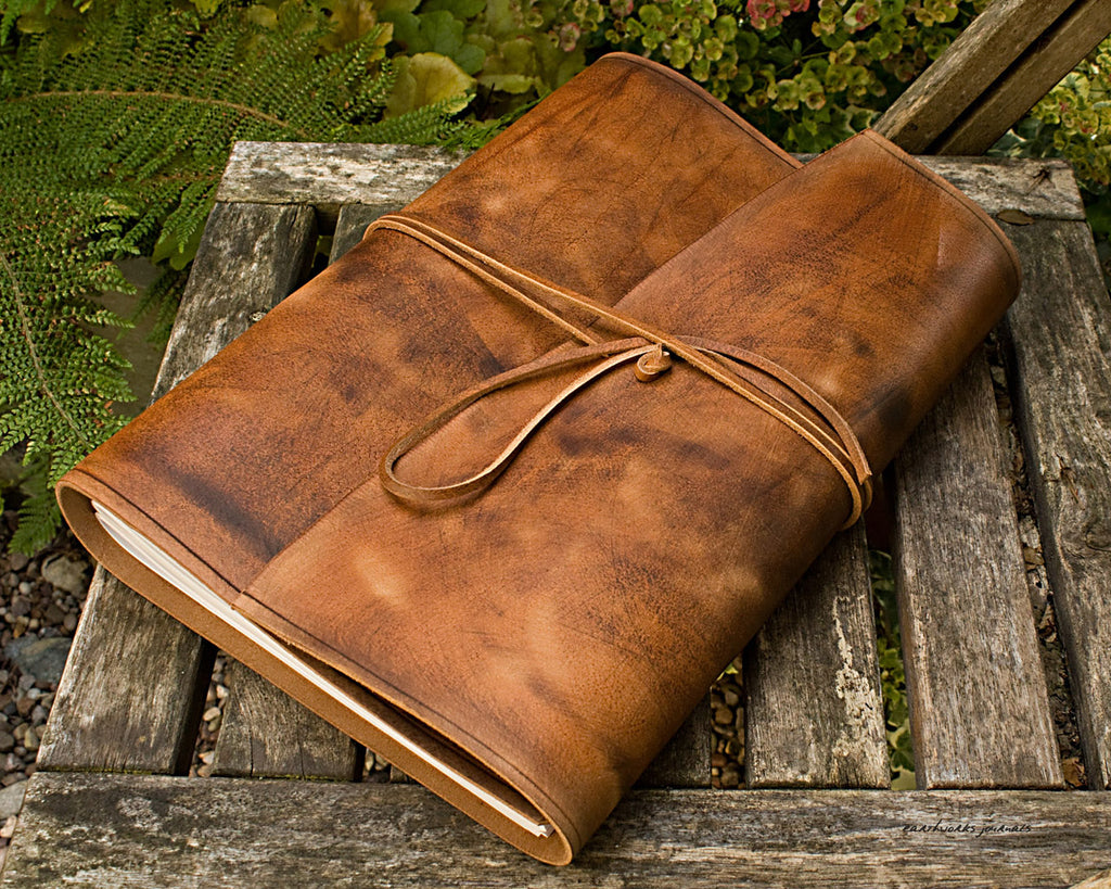 brown leather travel journal