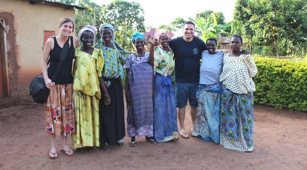 Women in Uganda smiling with Because of Hope Founder Natalie Ruiz and her husband Daniel Ruiz.
