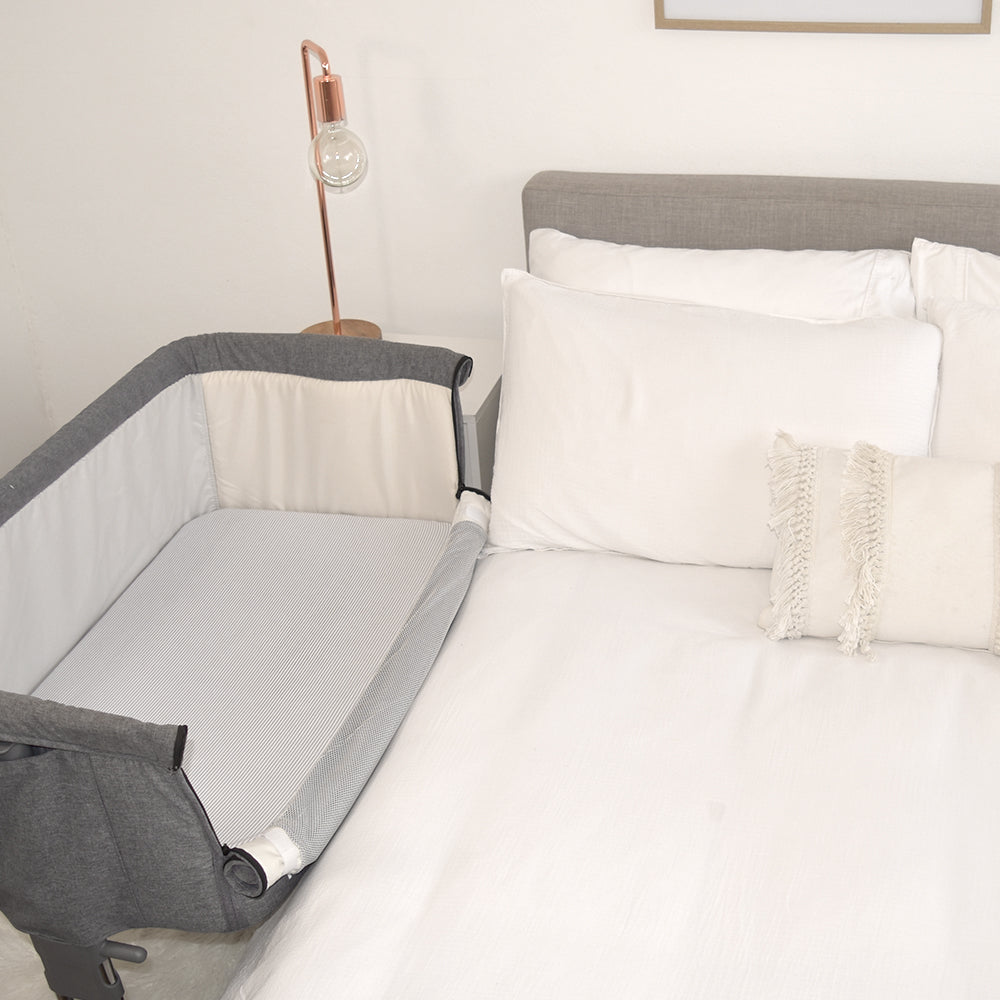 half crib attached to bed