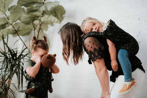 A mother and her two children having fun.