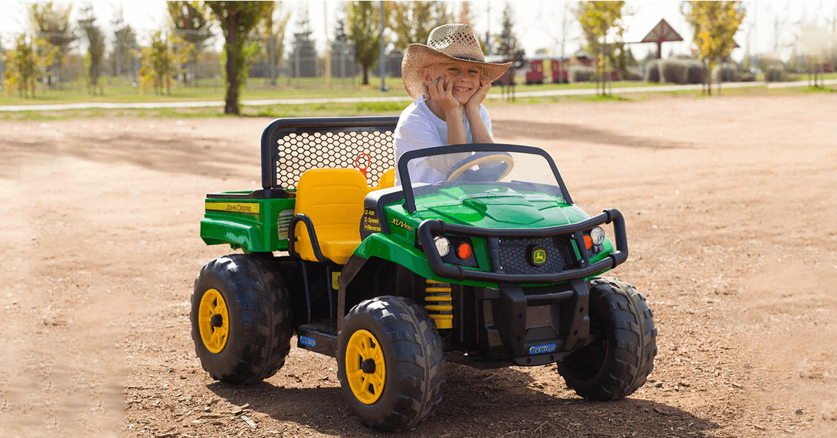 Kid-on-ride-on-car-in-backyard-park