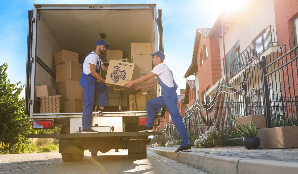 delivery men unloading bulky toy boxes