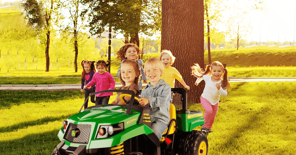 group-of-kids-in-the-park-with-ride-on-car