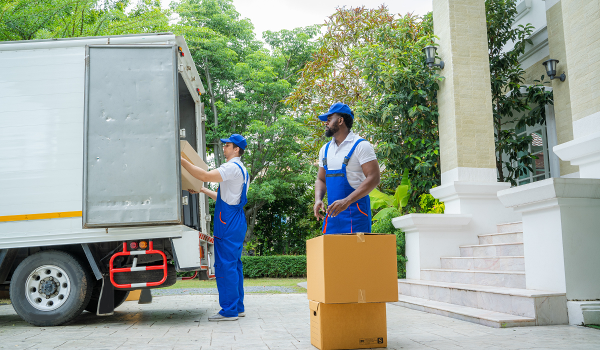 delivery-men-unloading-boxes-from-truck-in-a-residential-area