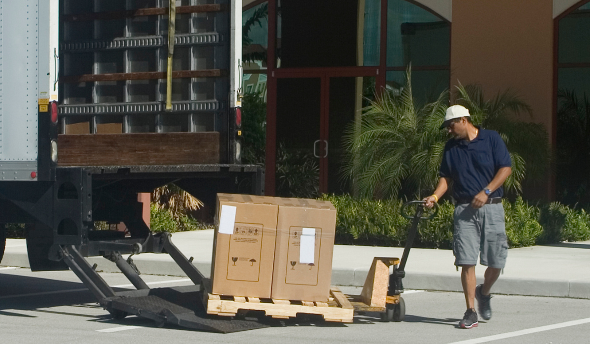 delivery-man-using-pallet-truck