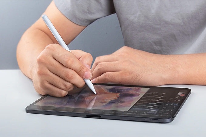 Image of a man sketching using Apple pencil