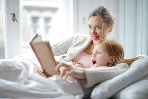 Mom and girls Russian book reading