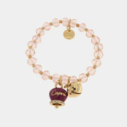 Bracciale in Metallo  campanella viola e piccolo sonaglio con pietre rosa