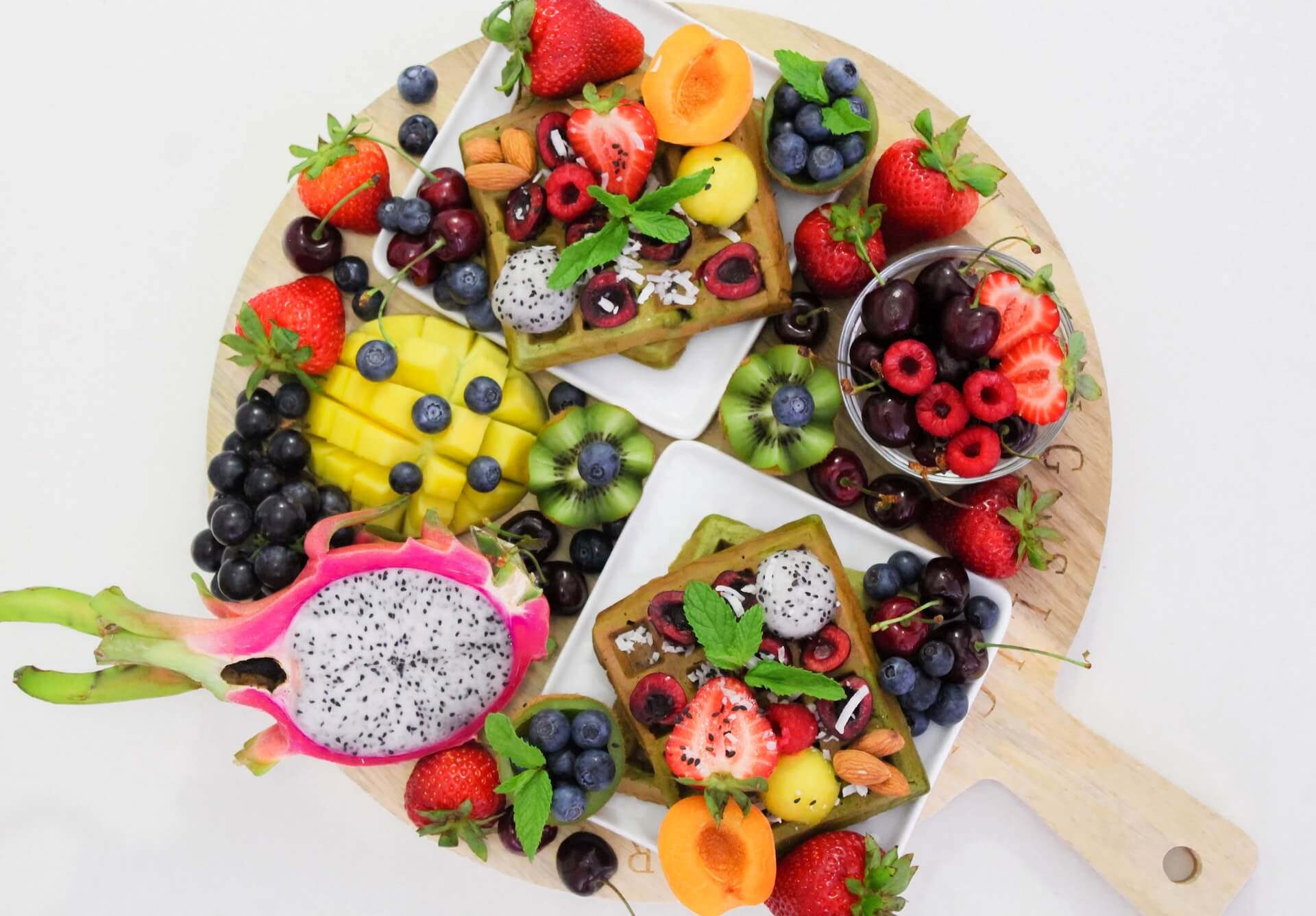 wooden plate with many healthy fruits