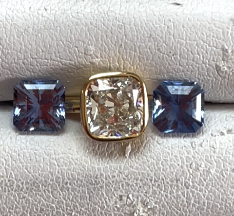 Diamond with pair of sapphire accents