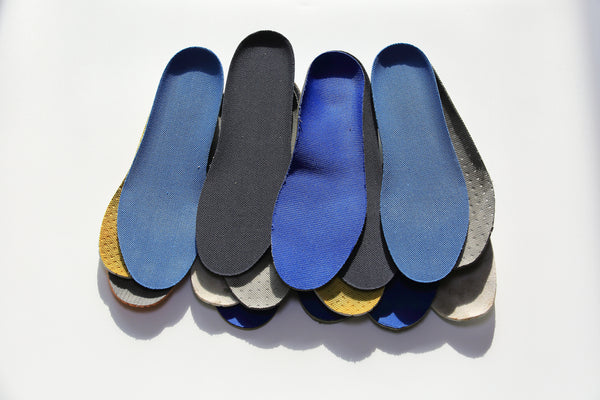 Pile of generic shoe insoles on the market