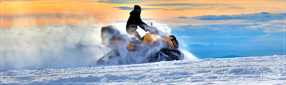 Snowmobiling through snow - PNW Life Featured Image