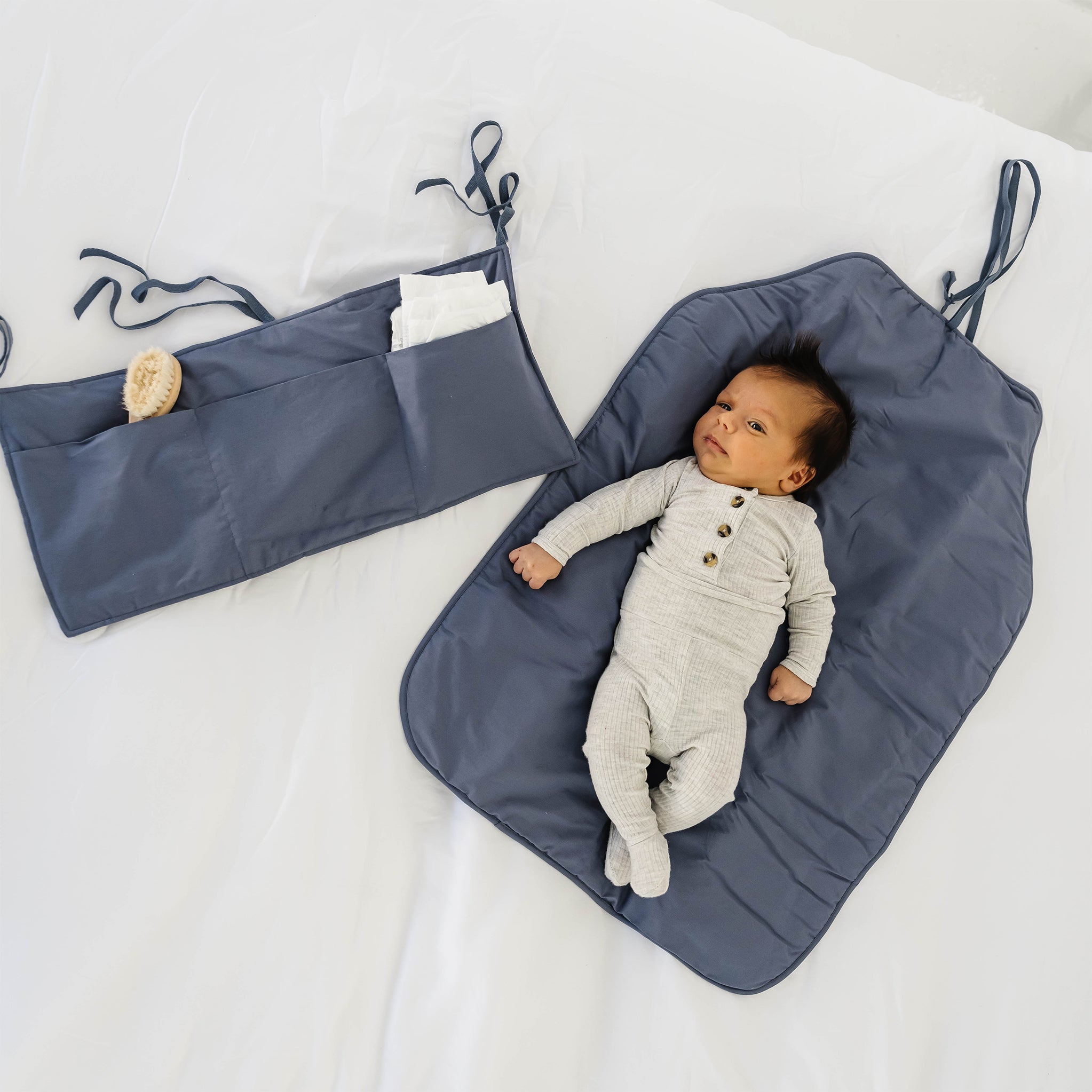 The Portable Diaper Changing Pad with Clean Hands Barrier - The Teething Egg