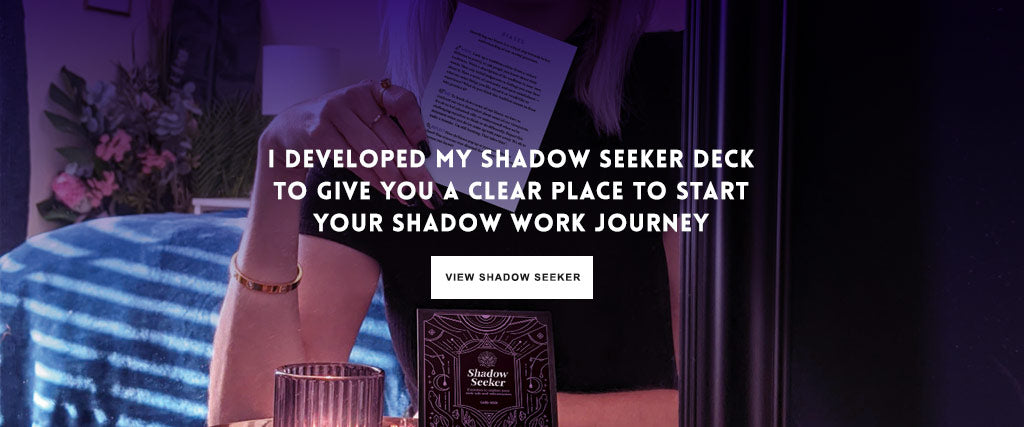 Woman holding a card from the Shadow Seeker deck by Vox Intra, the ultimate tool for shadow work