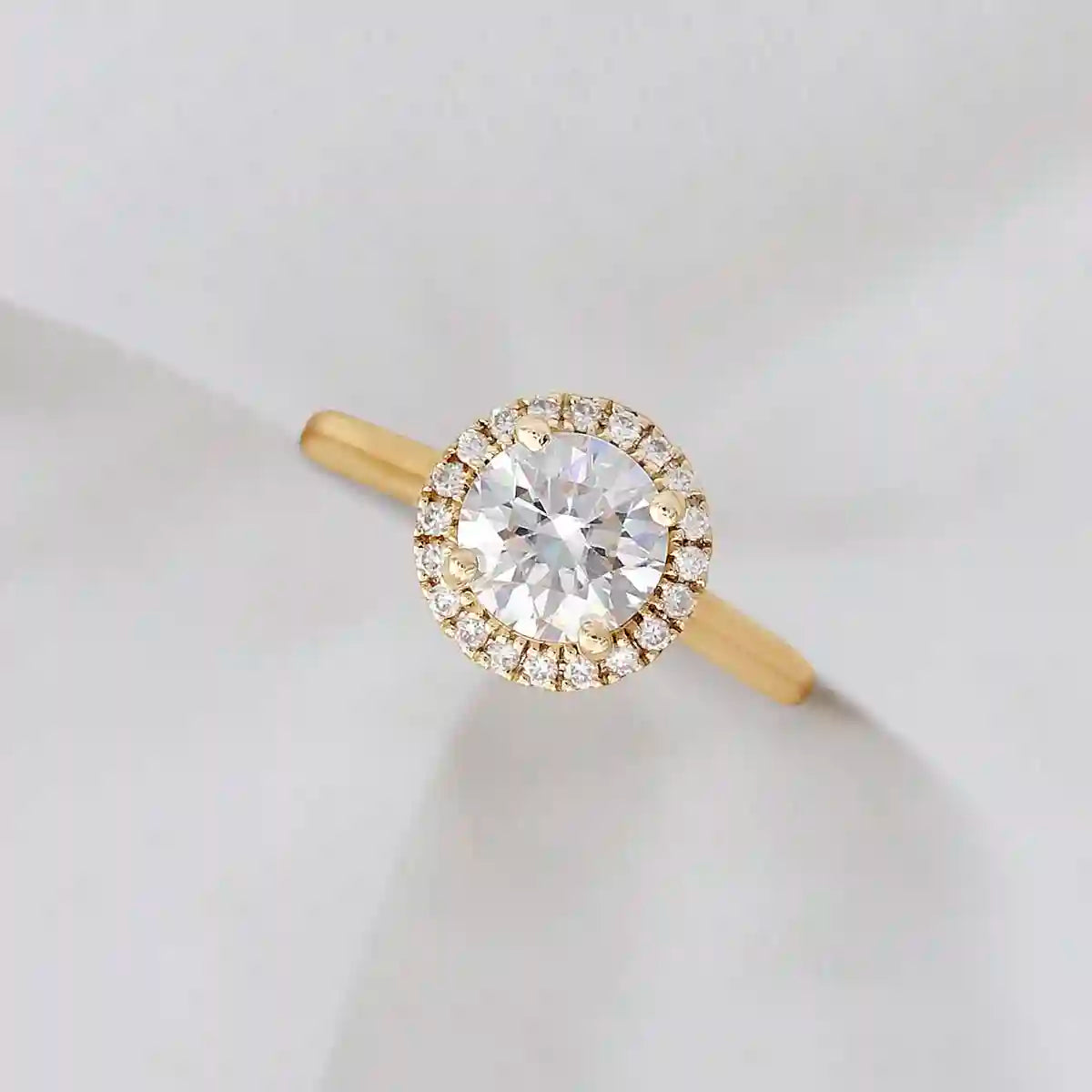 Bespoke yellow gold lab diamond engagement ring with pave diamond halo