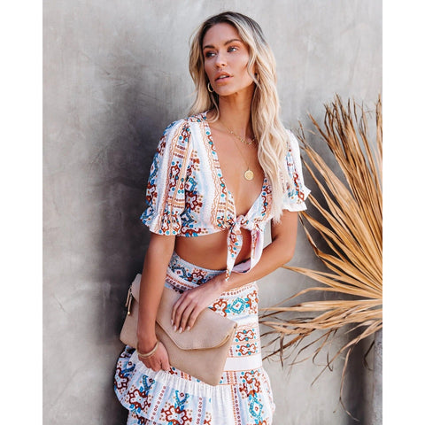 Beautiful white printed 2-piece skirt and crop top set with short sleeves, tie front, and ruffle tiers, What to Wear on Vacation With His Family, ShoptheKei.com