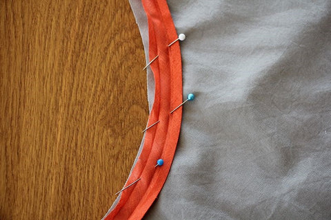 Pin bias tape to edge of garment