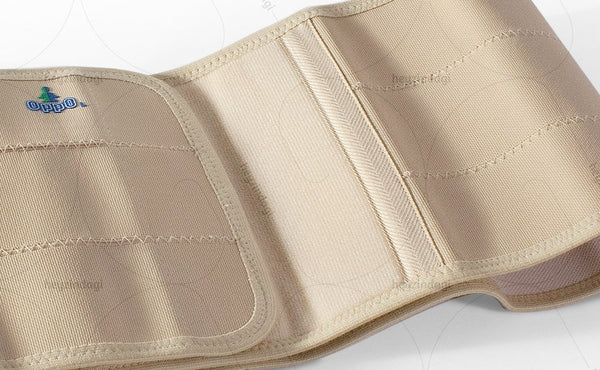 The hook fasteners connect with nylon fabric laminated on a foam panel that covers the stomach in the Abdominal Binder (Elastic) 2060 by Oppo Medical