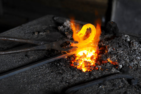 Heating Metal In a Hot Forge at Borderland Rustic Hardware for Authentic Decorative Metal, Steel, Iron, Forged DIY projects and crafts made in the US and Mexico in 2021