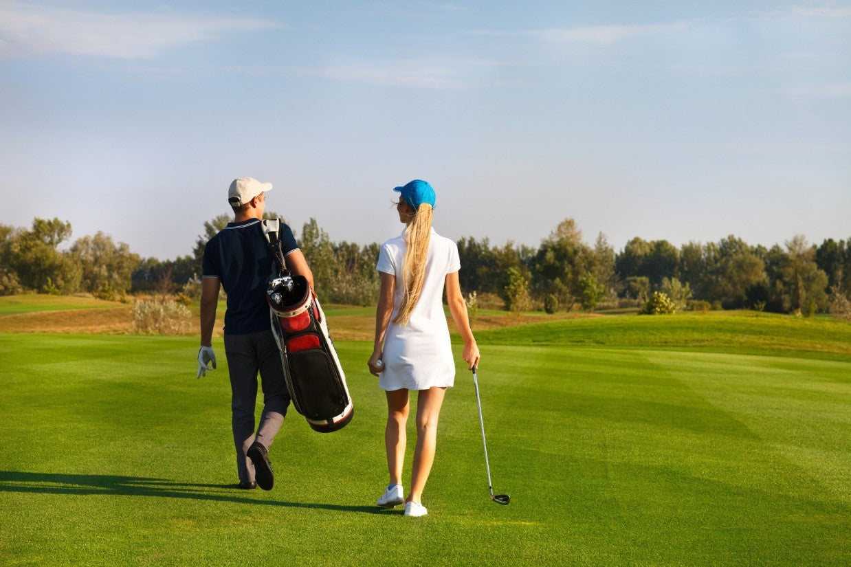 beginner golfers walking the greens