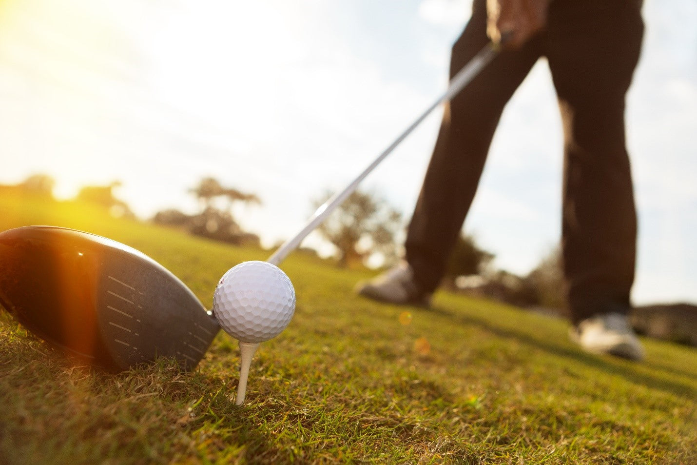 golfer lined up to hit off tee