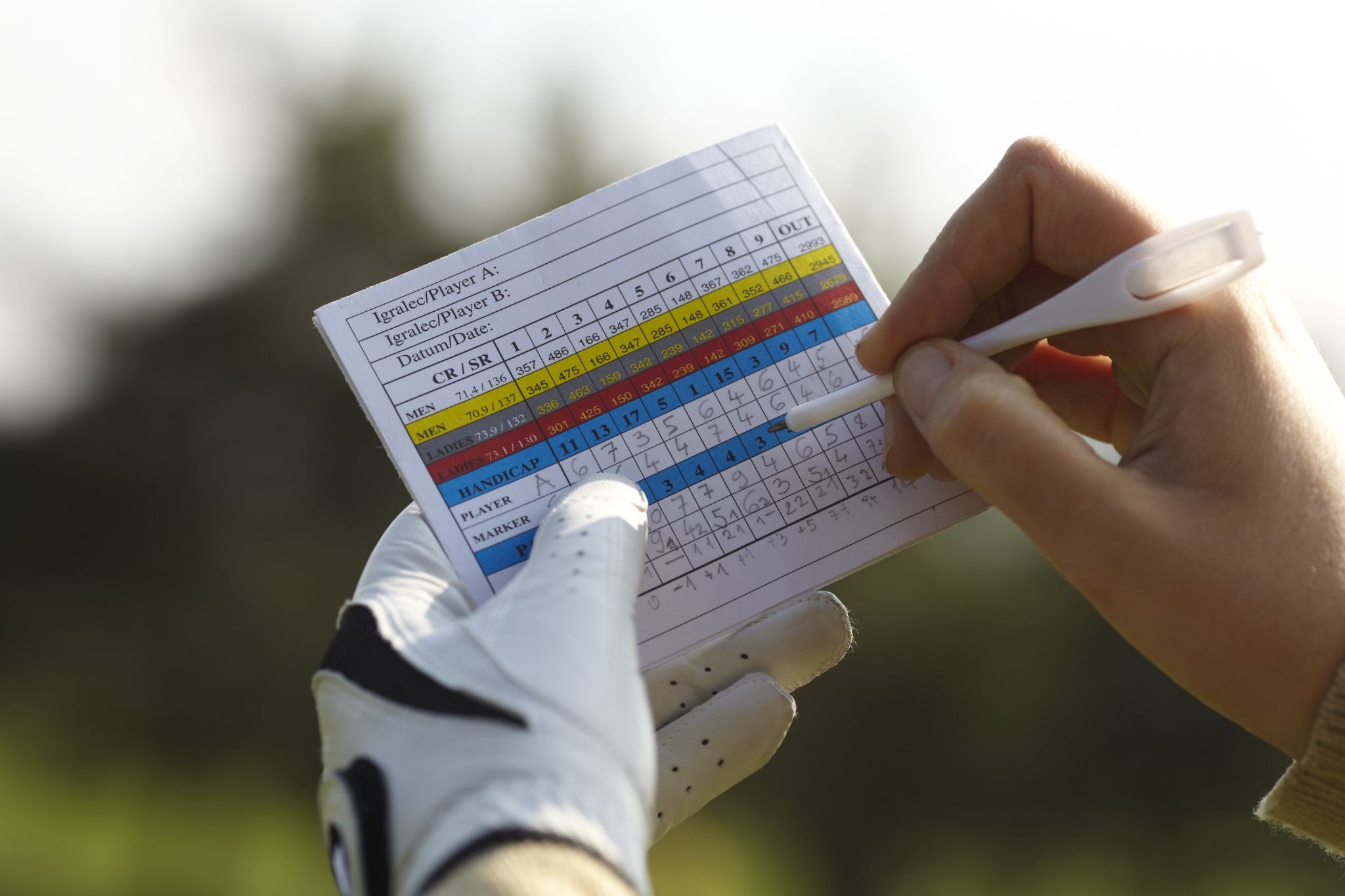 Writing golf handicap with a glove