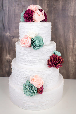 Sola wood flowers on a three-tier cake