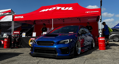 Motul booth with Subaru STI 