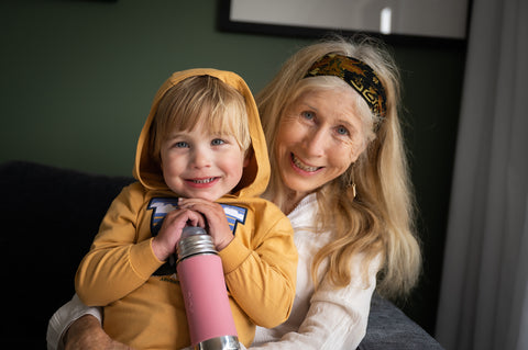 Smiling Boy and Grandmother with Mothers Day Gift