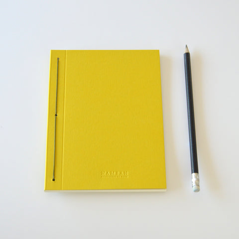 Thin yellow notebook