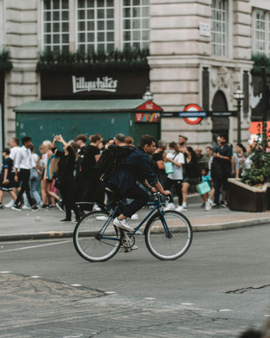Man cycling on the street in London.