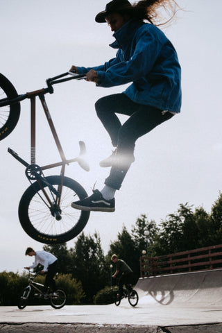 A skilled rider performing freestyle BMX stunt.