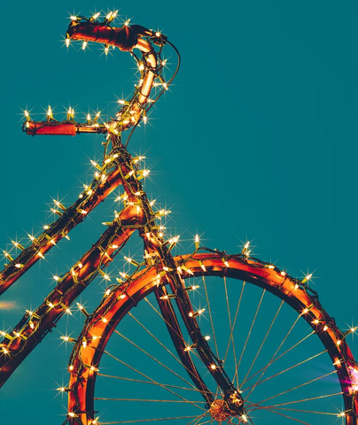 fairy lights wrapped around bike