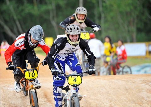Young competitors going through the BMX course during the validation exercise at Tampines Bike Park