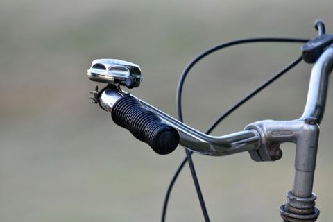 Close-up shot of a bicycle bell attached on the handlebar