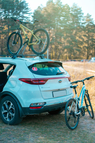 A mountain bike on a car's roof