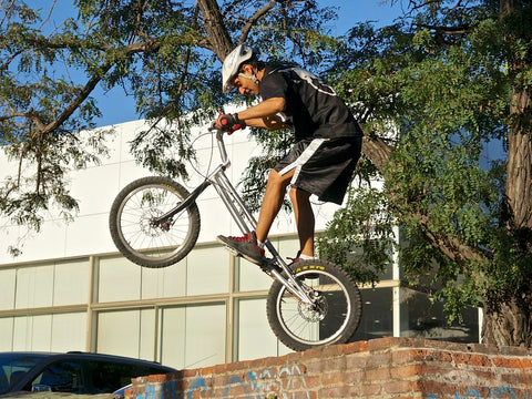 BMX rider performing BMX street-style stunt.