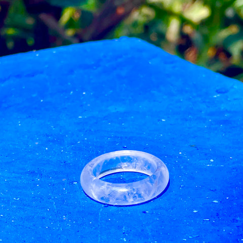 caruba white quartz stone band ring from whitestone jewelry co. displayed on a blue background at Frida Khalo's house in Mexico City