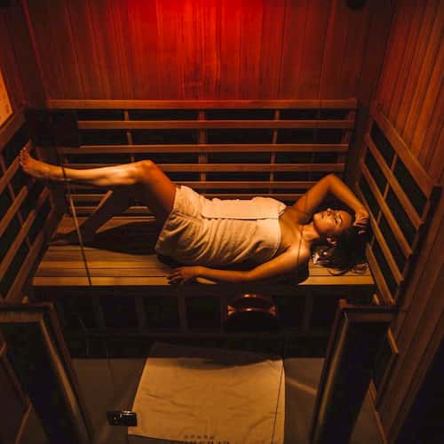 Woman laying in sauna
