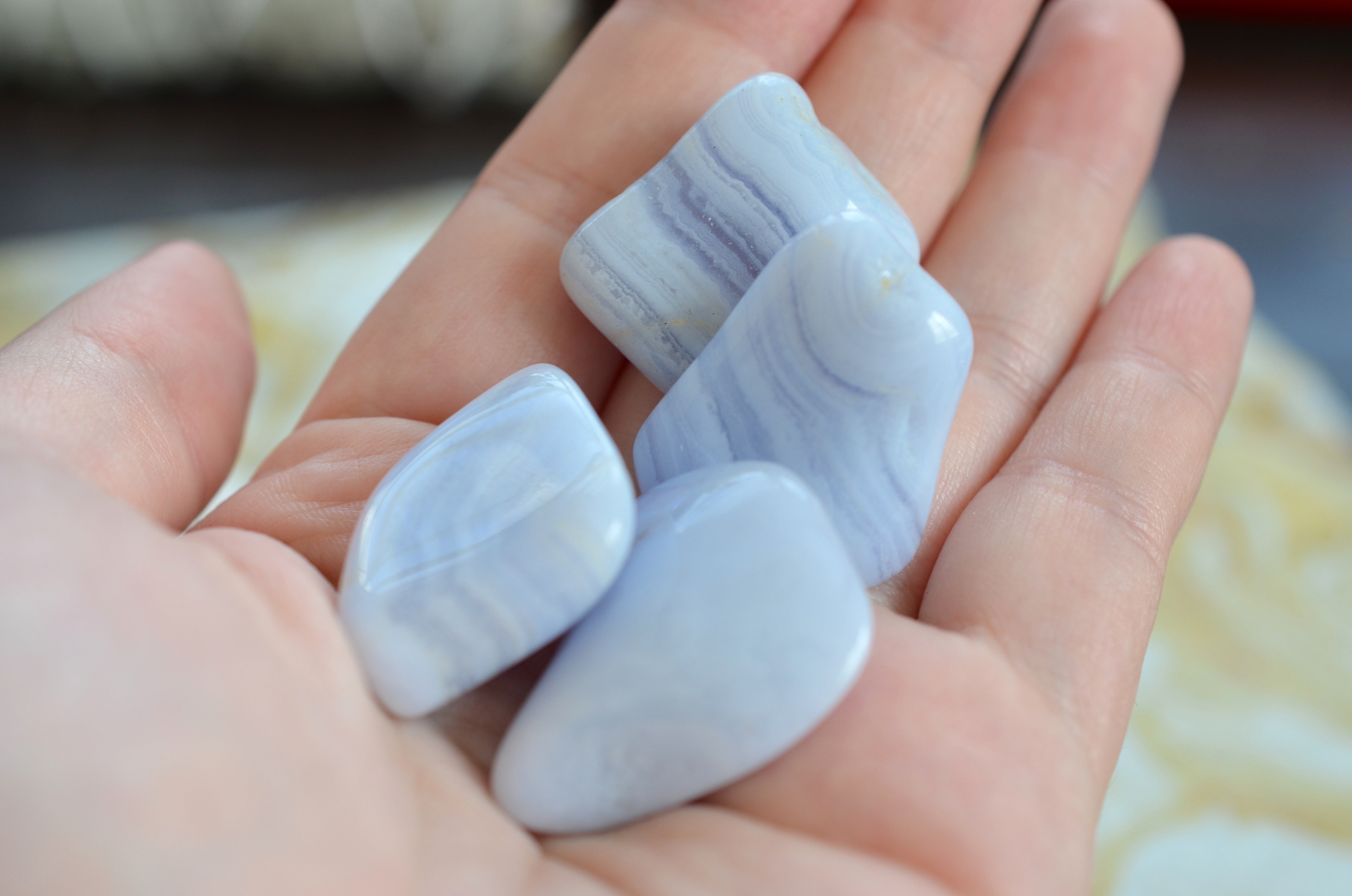 blue lace agate stones in hand